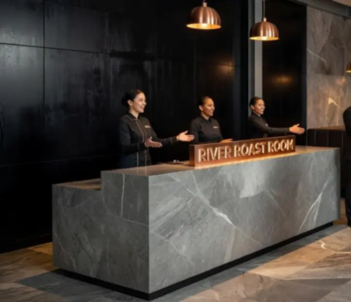 Front-of-house hospitality team greeting guests at River Roast Room.