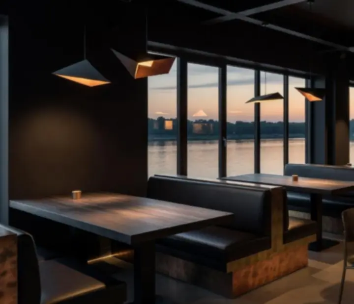 Interior of River Roast Room with blackened steel, copper accents, and timber seating